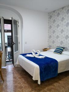 Cama o camas de una habitación en Madrid Playa Rooms