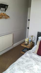 A bed or beds in a room at Streonshalh Bed & Breakfast 