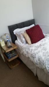 A bed or beds in a room at Streonshalh Bed & Breakfast 