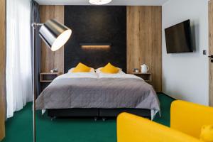 Posteľ alebo postele v izbe v ubytovaní Apartamenty PORTO