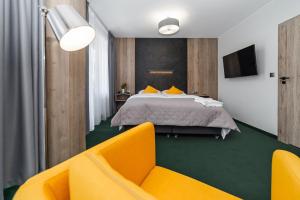 Posteľ alebo postele v izbe v ubytovaní Apartamenty PORTO