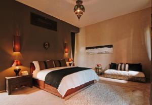Ένα ή περισσότερα κρεβάτια σε δωμάτιο στο The Capaldi Hotel, Restaurant & Spa