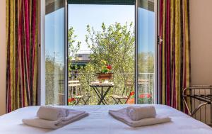 A bed or beds in a room at Top Floor Trastevere