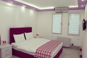 Ένα ή περισσότερα κρεβάτια σε δωμάτιο στο ECS Suw Hotel