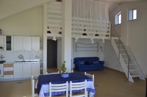 A kitchen or kitchenette at residence scala dei turchi