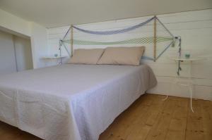 A bed or beds in a room at residence scala dei turchi