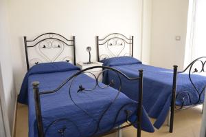 A bed or beds in a room at residence scala dei turchi