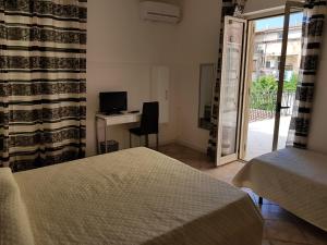 Postel nebo postele na pokoji v ubytování B&B Dimora del centro