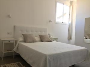 Postel nebo postele na pokoji v ubytování Can Moragues de Soller