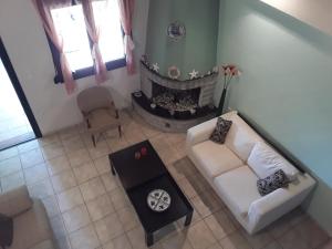 an overhead view of a living room with a fireplace at Calm Point Home in Volissos