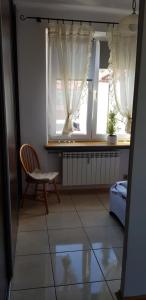 Ένα ή περισσότερα κρεβάτια σε δωμάτιο στο Apartament Aga2