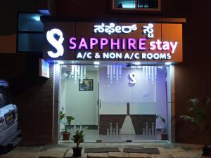 a sign on the front of a saphire stay ale and non at Sapphire stay in Bangalore