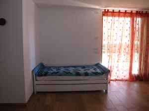 A bed or beds in a room at B&B Baratoff