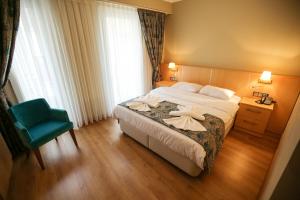Кровать или кровати в номере Artika Hotel