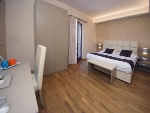 Un ou plusieurs lits dans un hébergement de l'établissement Hotel Dori