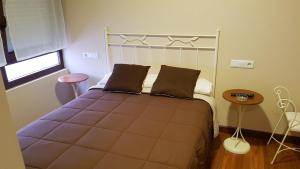 Hostal Arenal客房内的一张或多张床位