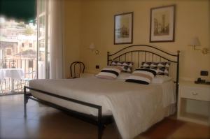Postel nebo postele na pokoji v ubytování Hotel Relais Modica