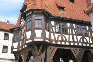 a wooden building with a red roof at Ferienwohnung Schaefer in Michelstadt