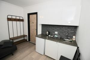 Kuchyň nebo kuchyňský kout v ubytování Apartment N322 Gudauri Loft