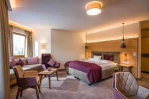 Postel nebo postele na pokoji v ubytování Hotel Bergkristall