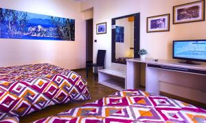 Televízia a/alebo spoločenská miestnosť v ubytovaní Solaris B&B