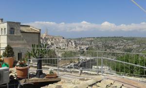 a view of the city from a balcony of a building at Il Sogno e La Stella in Matera