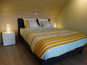Postel nebo postele na pokoji v ubytování De Karaneel