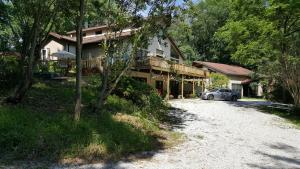 a house with a car parked in front of it at Tortuga Inn in Winamac