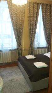 Postel nebo postele na pokoji v ubytování Taurus Apartments Vilnius