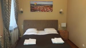 Postel nebo postele na pokoji v ubytování Taurus Apartments Vilnius