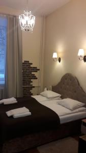 Postel nebo postele na pokoji v ubytování Taurus Apartments Vilnius