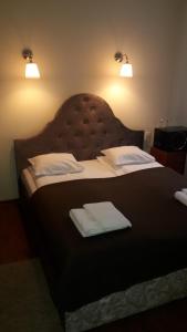 Postel nebo postele na pokoji v ubytování Taurus Apartments Vilnius