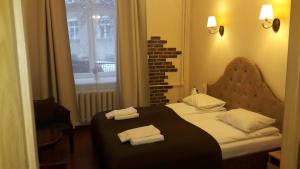 Postel nebo postele na pokoji v ubytování Taurus Apartments Vilnius