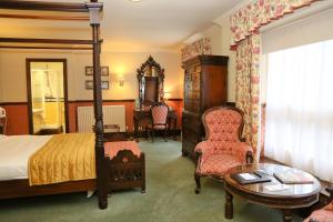 Postel nebo postele na pokoji v ubytování Millfields Hotel