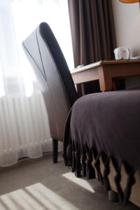 Postel nebo postele na pokoji v ubytování Hotel De Hofkamers