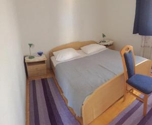 Ein Bett oder Betten in einem Zimmer der Unterkunft Apartments Bili