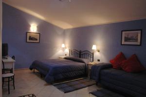 Postel nebo postele na pokoji v ubytování Hotel Relais Modica