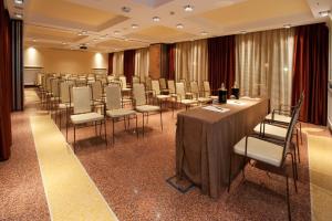 a conference room with a long table and chairs at Grand Hotel Savoia in Genoa