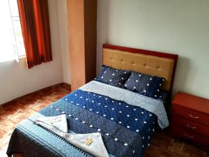Letto o letti in una camera di Hospedaje Central Piura