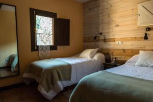 Posteľ alebo postele v izbe v ubytovaní Hotel Rural Don Burguillo