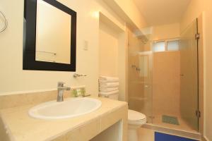 a bathroom with a sink and a toilet and a mirror at Hotel Santa Rita in Guanajuato +52 photos