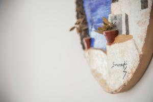 a close up of a book with a plant on it at Smaragdi in Perivolos
