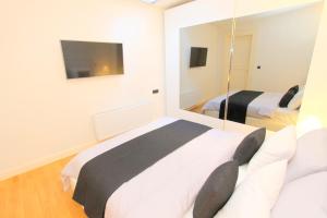 Postel nebo postele na pokoji v ubytování Luxury apartments Krocínova