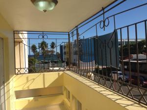 a balcony with a view of a city at Caribbean Seaview apart Malecon Santo Domingo in Santo Domingo