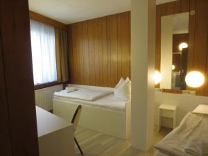 A bed or beds in a room at Central-Hotel Tegel
