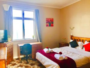 Voodi või voodid majutusasutuse Harbourview Stadium Hotel toas
