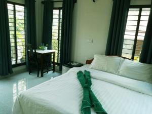 A bed or beds in a room at Angkor Sweet Home
