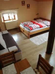 A bed or beds in a room at Ubytovani na hradbach