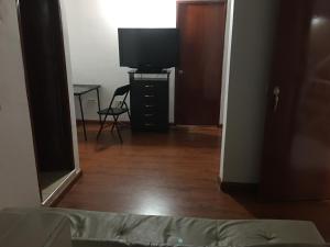 TV a/nebo společenská místnost v ubytování Casa hotel Sports and Family