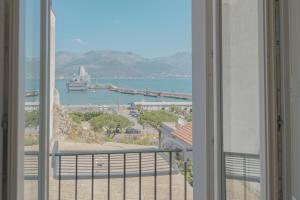a view of the water from a room with a window at Hello Gaeta Apartment in Gaeta